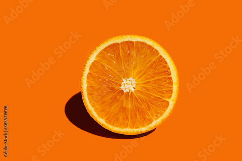 Orange fruit. Round orang slice isolate on colorful background.
