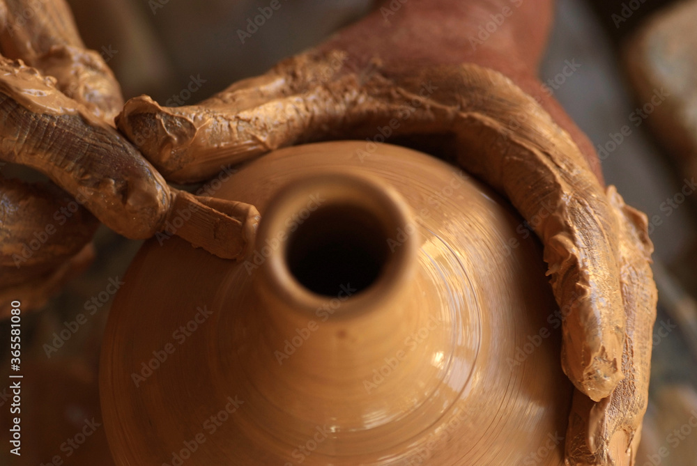 A man doing hand-made pottery clay handicrafts A man doing hand-made pottery clay handicrafts