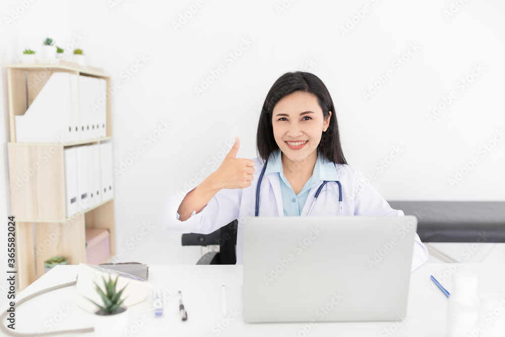 asian female doctor search information and typing report with laptop, she show thumbs up sign with hand, medical knowledge technology, happiness hospital asian female doctor search information and typing report with laptop, she show thumbs up sign with hand, medical knowledge technology, happiness hospital