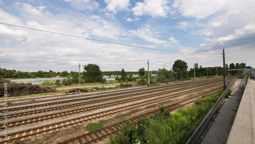 Smooth camera movement along a railroad in Vienna, Austria in daylight, summer Smooth camera movement along a railroad in Vienna, Austria in daylight, summer