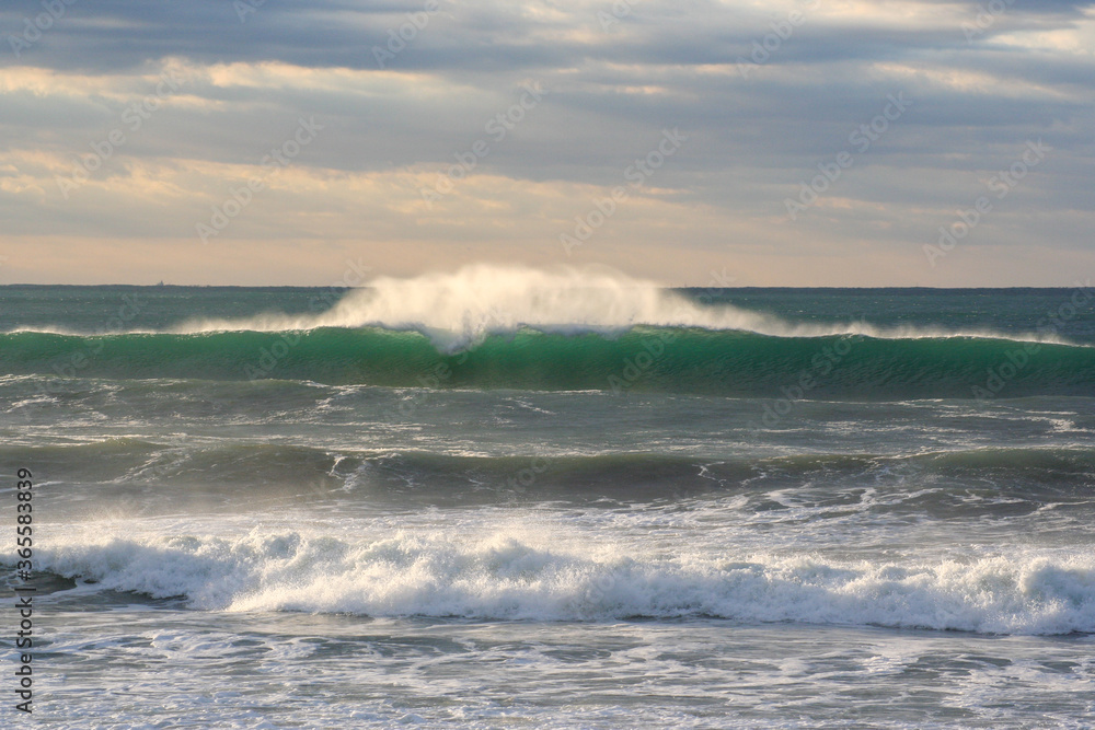 Waves breaking in the Pacific Ocean close to Japan these are the type surfers like to ride. The beach is close to Tokyo City.