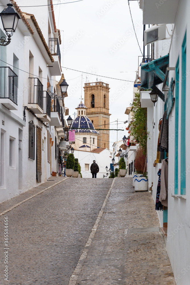 Obraz premium Cobbled street with view to the church of Altea old town, Costa Blanca, Spain