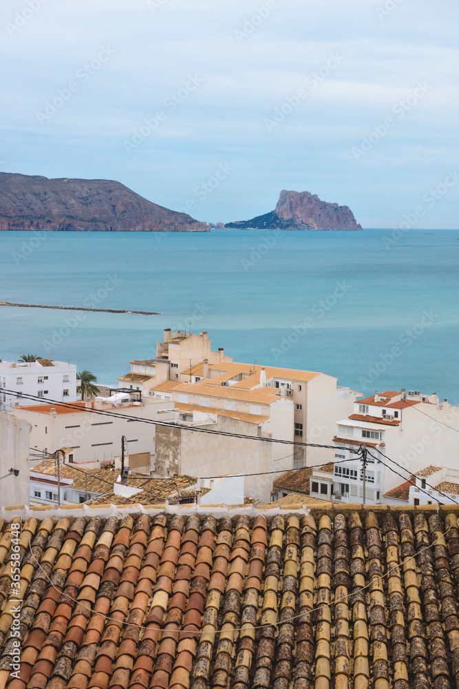 View over the roofs of old town to the ocean and the rock of Calpe, Altea, Costa Blanca, Spain