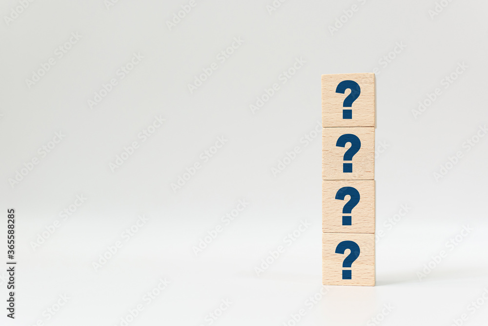 Wooden cube block shape with sign question mark symbol on white background Wooden cube block shape with sign question mark symbol on white background