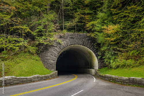North Carolina roadway disappearing into the mountain tunnel.