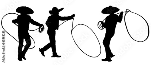 Silhouette of Mexican Cowboys with lasso rope doing tricks photo