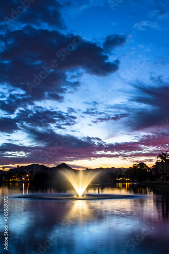 Sunset over the lake and the fountain