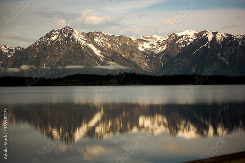 Grand Teton Mountain Range Reflected in Lake at Sunrise
