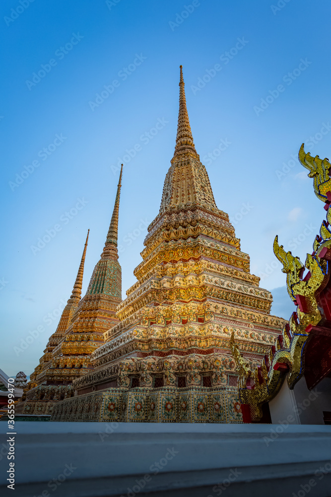 Fototapeta premium BANGKOK, THAILAND -July 6, 2019:Wat Phra Chettuphon Wimon Mangkhalaram Ratchaworamahawihan or the former name Wat Pho, also known as The Temple of the Reclining Buddha, is a Buddhist temple in Phra Na