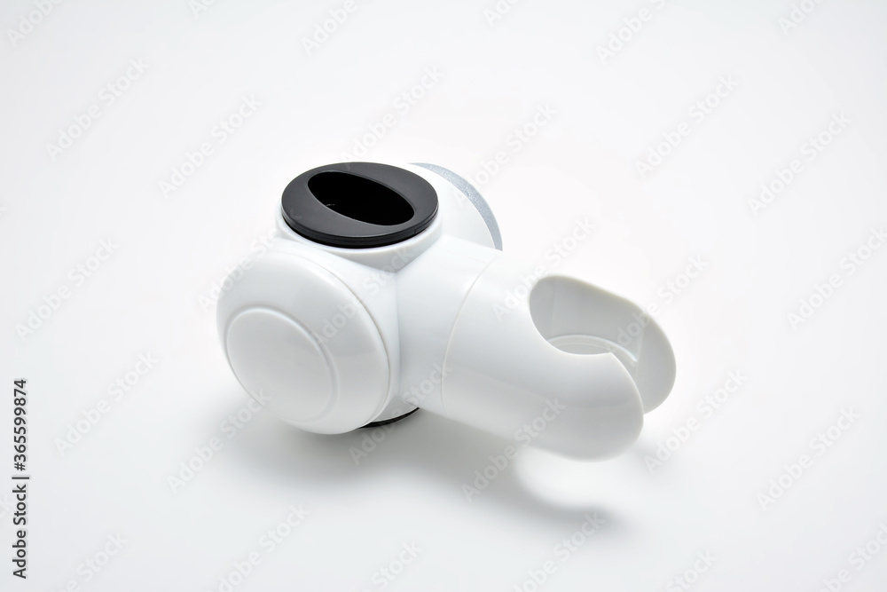 White plastic bathroom shower head holder White plastic bathroom shower head holder