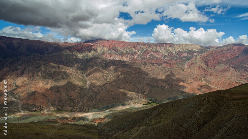 Geology. The valley and colorful mountains. Aerial view of the landmark Hornocal, its colors, texture and valley, under a beautiful sky.