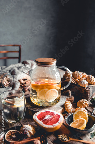 Hot tea with slices of fresh grapefruit on wooden tablet. Healthy drink  Eco  vegan