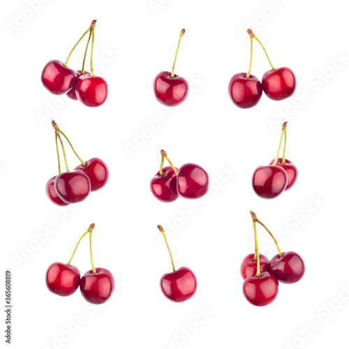 Set of ripe red sweet cherries isolated on white.