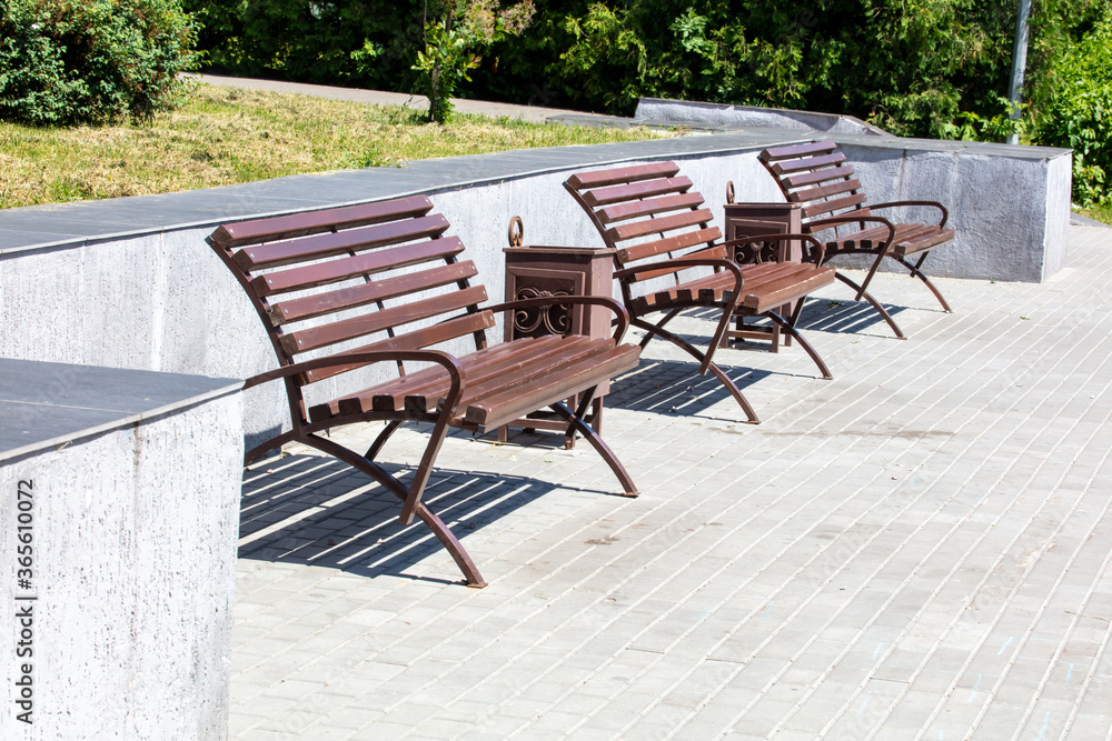 Bench near the road in the park.