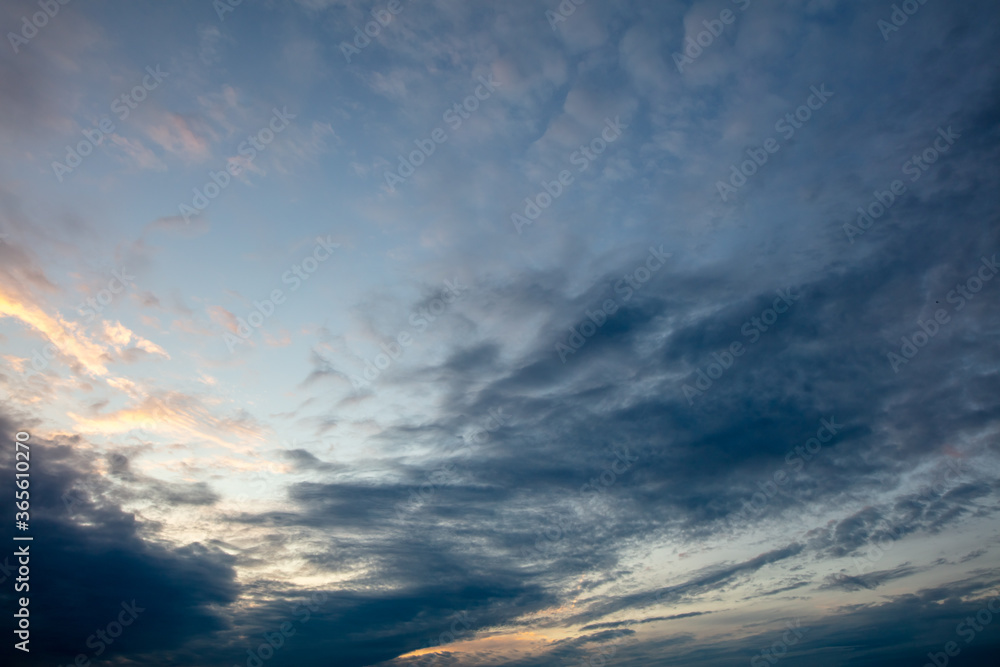 Naklejka premium Clouds after rain on the sky at sunset.