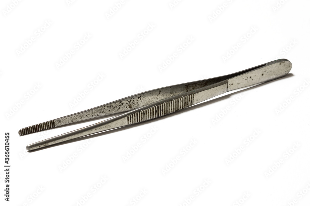 Rusty and old forceps on white background. Rusty and old forceps on white background.