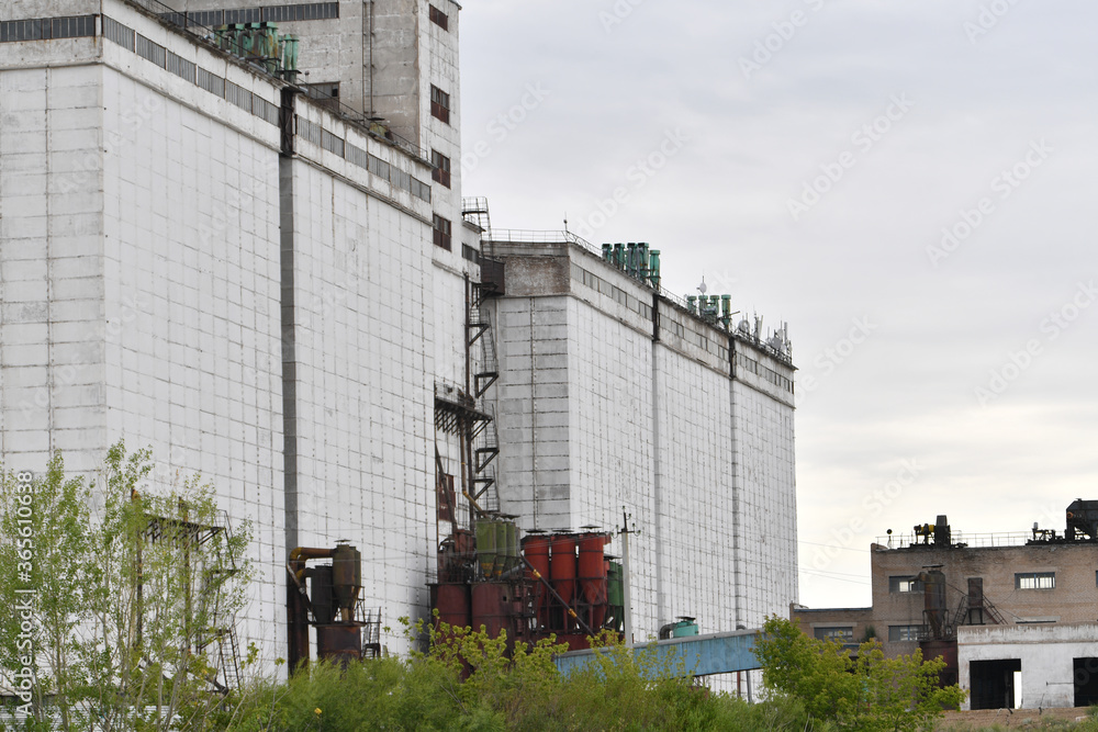 building, sky, architecture, industry, industrial, silo, blue, house, factory, construction, city, agriculture, plant, farm, silos, storage, clouds, business, metal, urban, grain, old, wall, roof, win