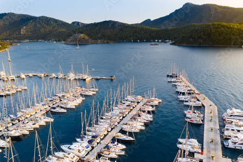 Yacht Marina. Footage of  many luxury boats and yachts in the harbor. Beautiful forested mountain landscape with the sea in the background. Orhaniye, Hisaronu, Marmaris - TURKEY photo