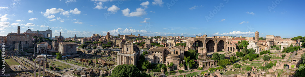 Panorama of the ancient Roman Forums, an archeological park with temples and basilicas near the Coliseum in Rome, Italy