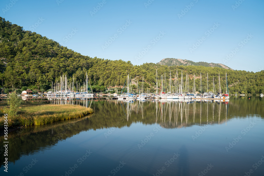 Kizkumu beach and yacht marina in Orhaniye. Famous for its shallow sand where people walk in the sea. Marmaris TURKEY