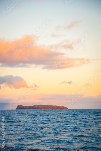 The island of Molokini, tinted sky, Maui, Hawaii photo