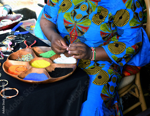 African lady creating unique necklaces