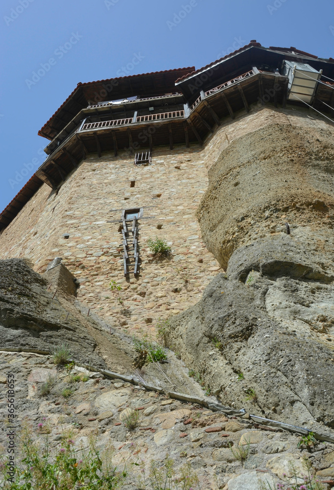 Holy Monastery of Saint Nicholas Anapafsas, Greece, summer 2019. Beautiful monastery that stands on top of amazing sandstone formations. Meterora is a famous tourist destination in Greece.