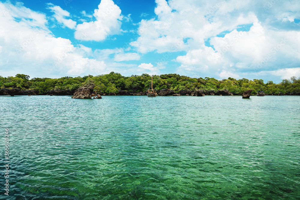 Fototapeta premium Boat near island with greenery in Zanzibar
