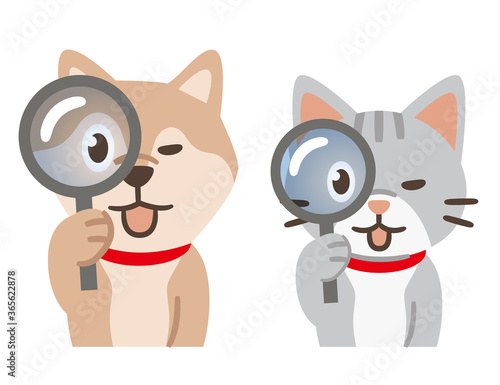虫眼鏡を覗く犬と猫