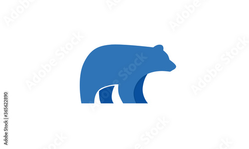 Minimalist, flat vector of a blue abstract polar bear silhouette with copy space beneath isolated against a white background. Illustration is great for icons, mascots, symbols, logos and branding.
