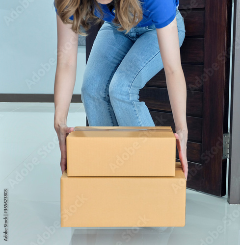 Quarantine or self isolated family receiving parcel box to door.