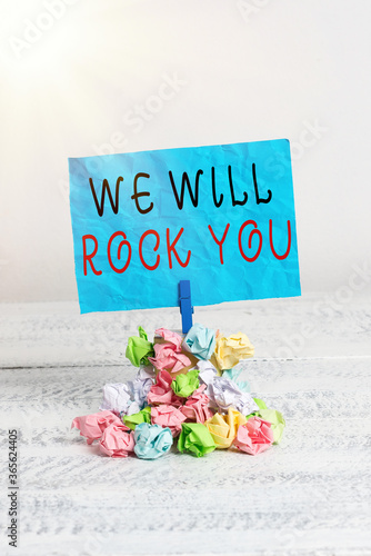 Conceptual hand writing showing We Will Rock You. Concept meaning to be going out and facing the world and all that is in it Reminder pile colored crumpled paper clothespin wooden space