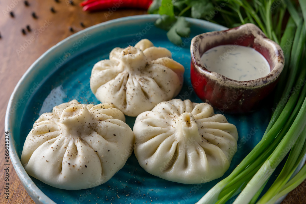 Homemade dumplings with pepper and herbs