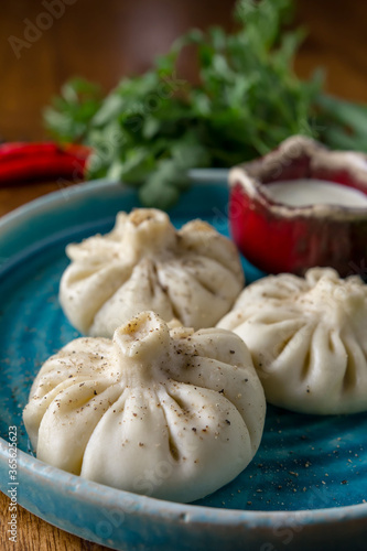Homemade dumplings with pepper and herbs