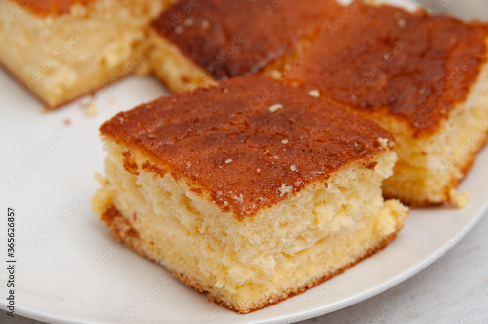 Traditional Brazilian dessert (known as Bolo Gelado) - Making step by step: Close-up of cake pieces. Traditional Brazilian dessert (known as Bolo Gelado) - Making step by step: Close-up of cake pieces.