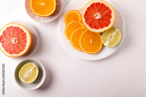 sliced citruses on white 