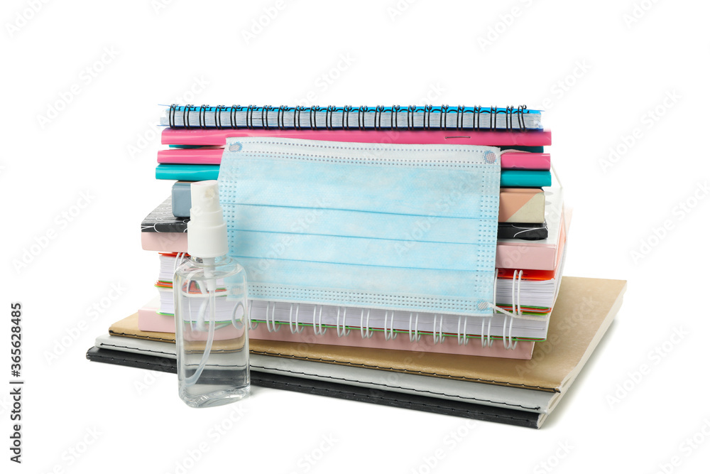 School supplies with medical mask and sanitizer isolated on white background School supplies with medical mask and sanitizer isolated on white background
