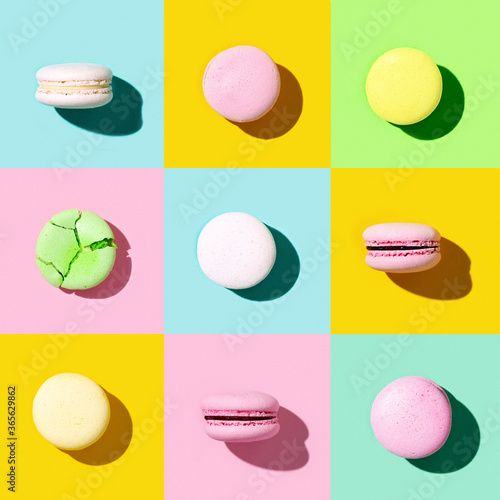 Regular creative pattern of colorful french cookies macarons. Pop art style banner. photo