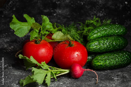 radish with tomatoes on a black background