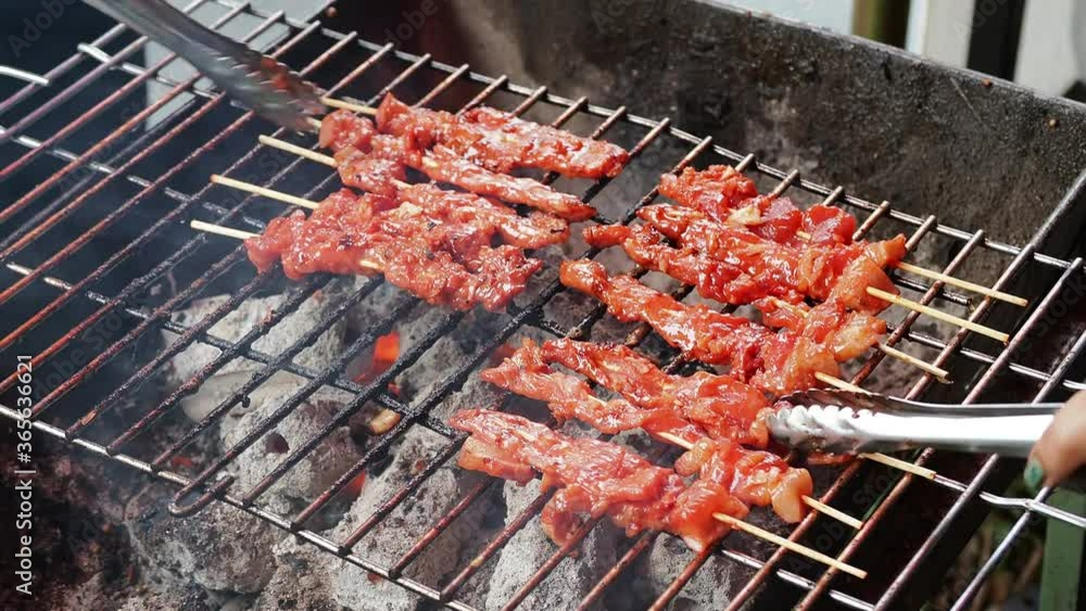 Grilled pork with sweet spicy sauce on the grill Is a simple and popular breakfast menu in thailand Grilled pork with sweet spicy sauce on the grill Is a simple and popular breakfast menu in thailand