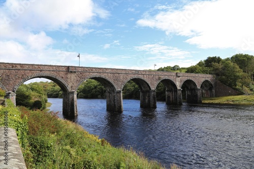 The historic seven arches bridge spanning the Newport River flowing through County Mayo, Ireland.