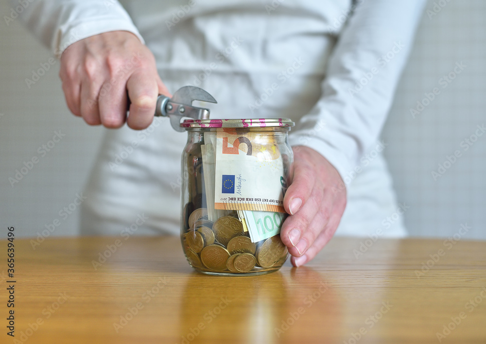 Saving Euro Money In Glass Jar. concept on the topic of financial savings