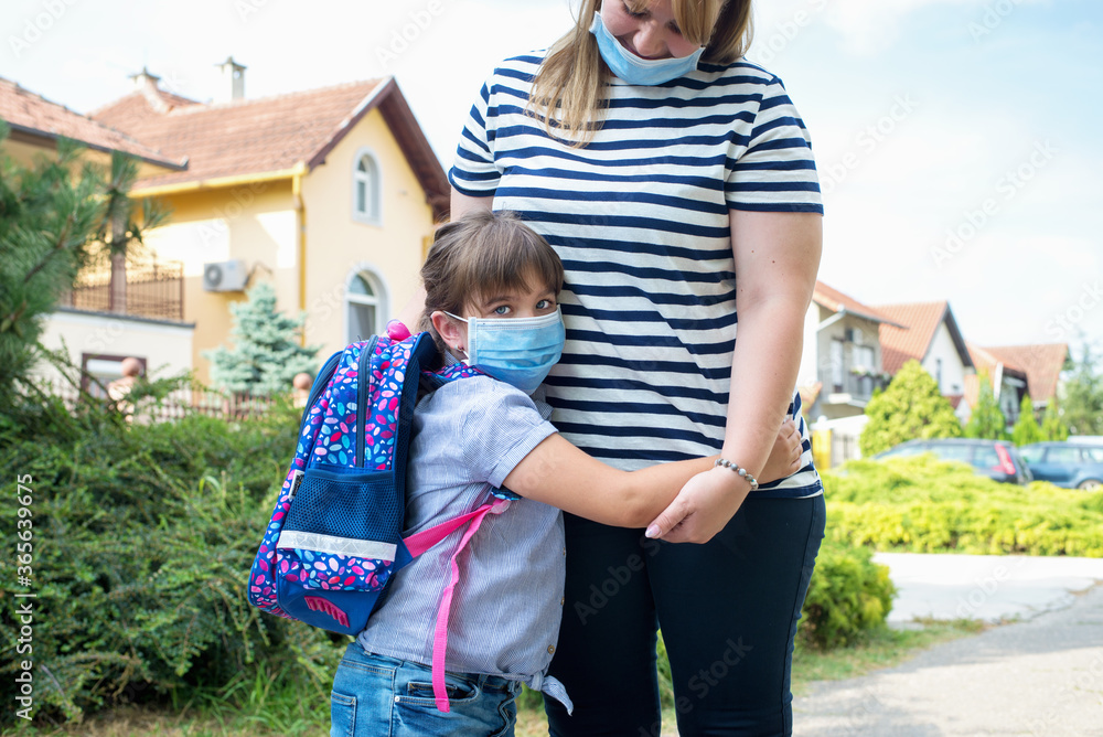 Mother and child wearing face masks Mother and child wearing face masks