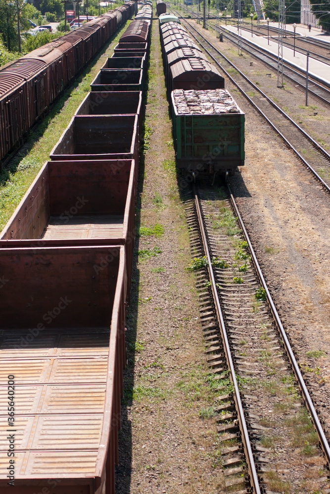 Empty wagons and freight wagons at a railway station Empty wagons and freight wagons at a railway station