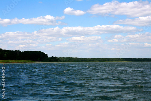 Lake in the summer under a cloudy sky