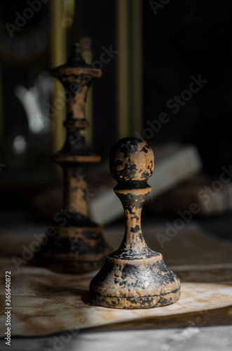 old wooden chess on black background in smoke