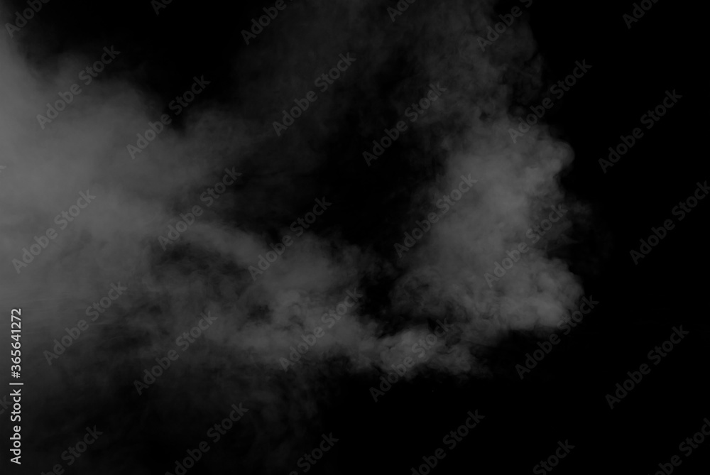 White smoke on a black background. The texture of scattered smoke. Blank for design. Layout for collages. White smoke on a black background. The texture of scattered smoke. Blank for design. Layout for collages.