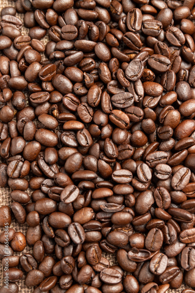 Roasted coffee beans on sackcloth. Roasted coffee beans on sackcloth.