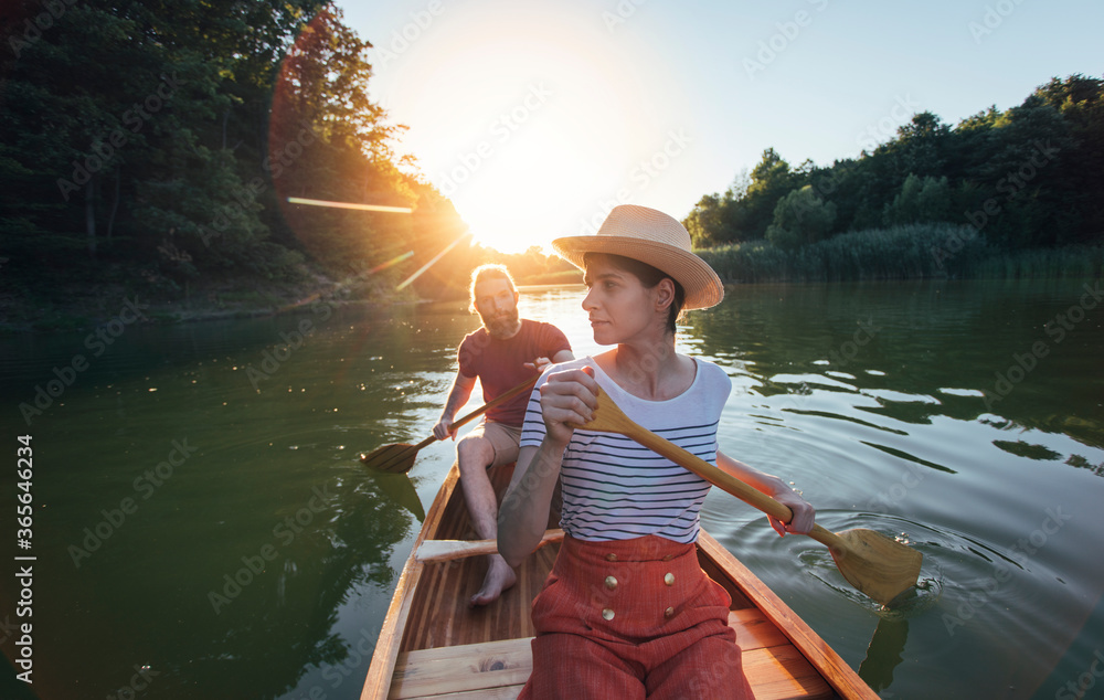Couple enjoying a summer canoe ride on the lake
Couple enjoying a summer canoe ride on the lake