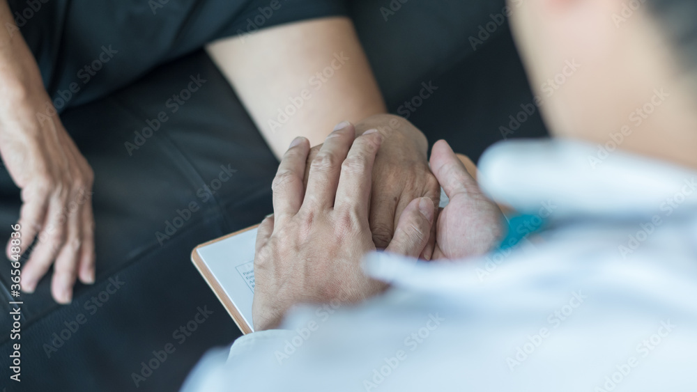 Parkinson disease patient, Alzheimer elderly senior, Arthritis person's hand in support of geriatric doctor or nursing caregiver, for disability awareness day, ageing society care service
